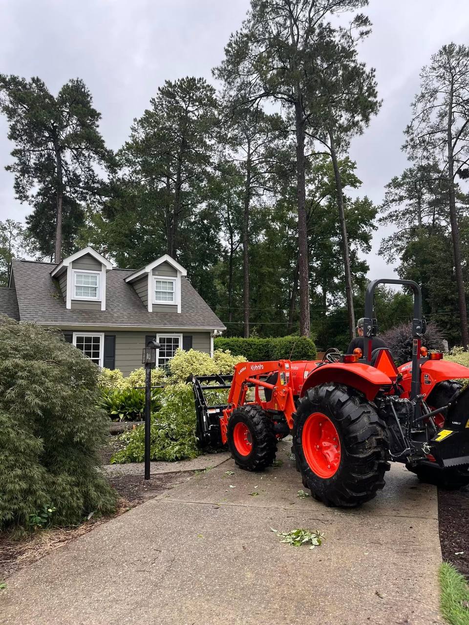 Causey Tree Experts equipment — Kubota tractor with grinder attachment